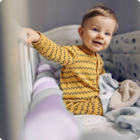 Chránič na dětskou postel pletený do copu RICO 300 cm - fialovo-šedý
