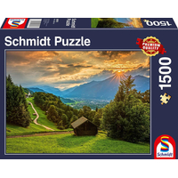 SCHMIDT Puzzle Západ slunce nad horskou vesnicí Wamberg 1500 dílků