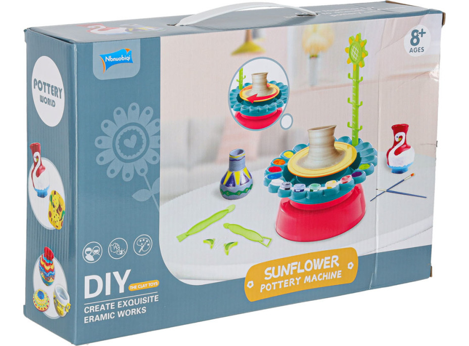 Hrnčířský kruh s hlínou a barvami