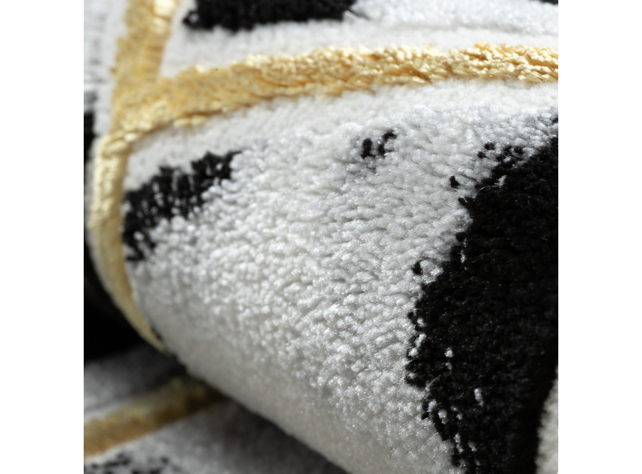 Kusový koberec Allure 1966 black/gold